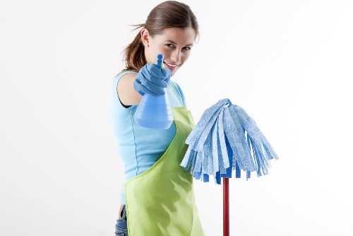 Carpet cleaning technician preparing equipment safely