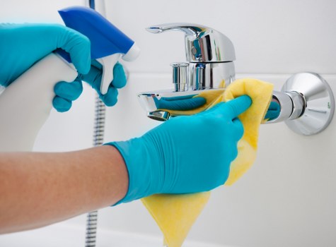Reliable cleaner in Ealing preparing a bright kitchen area